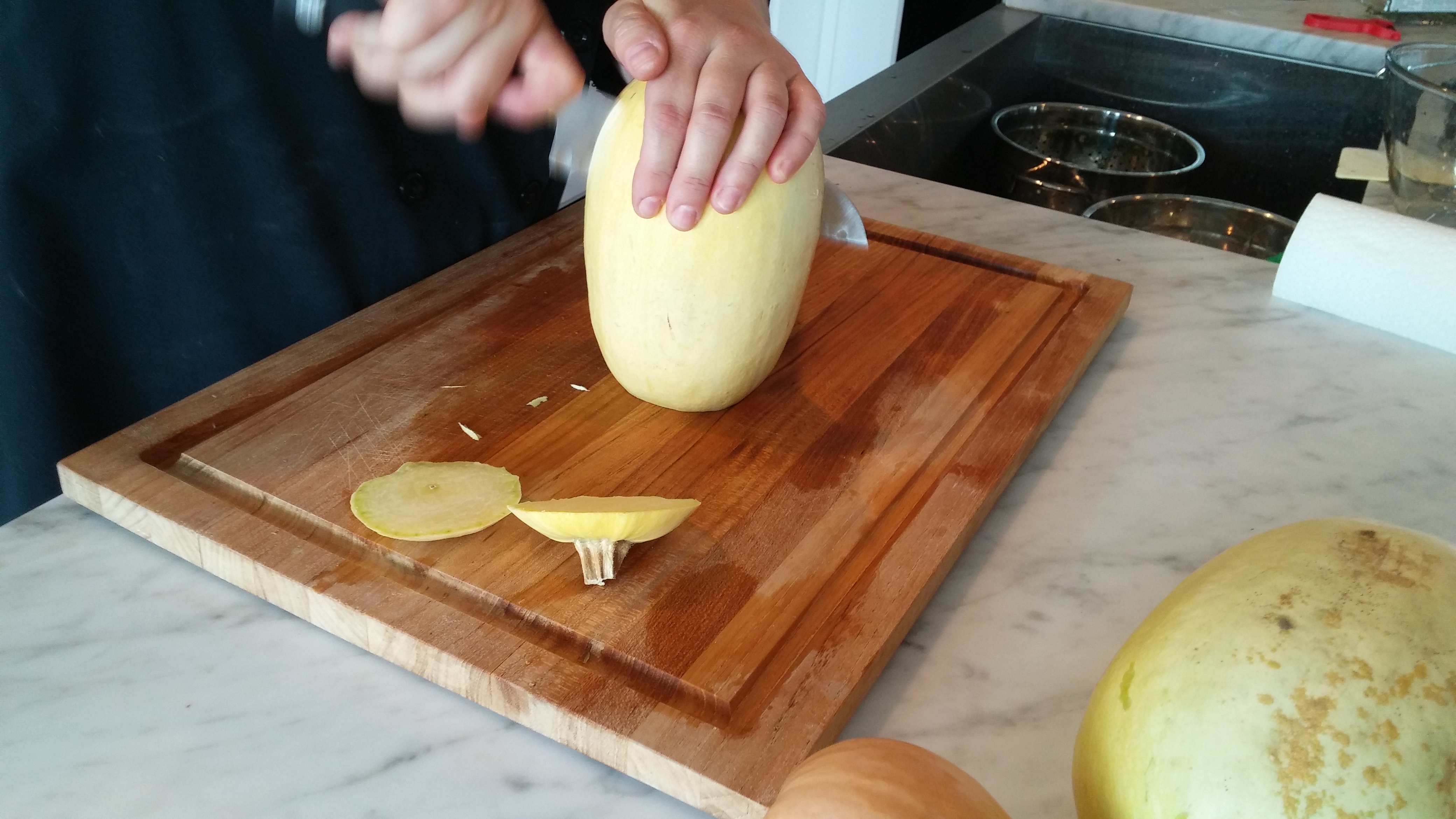 Turn the squash on end and slice in two. 