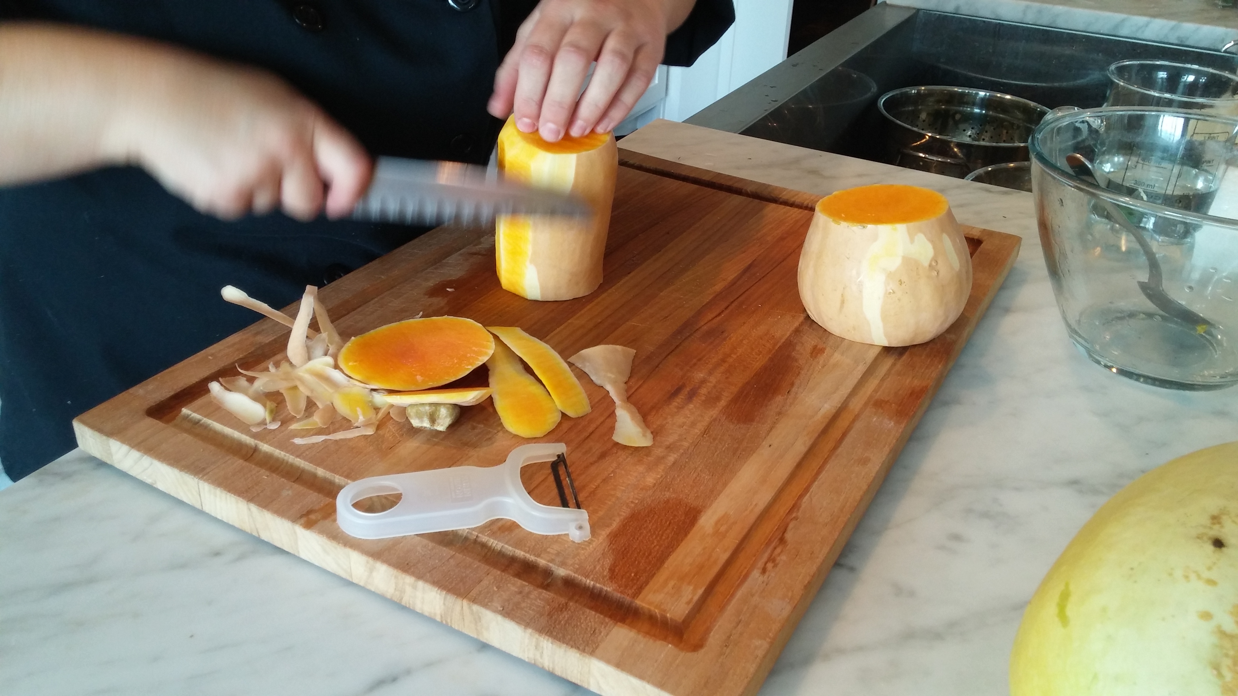 Peel the thin skin from a butternut squash using either a knife or a vegetable peeler. Remove the seeds from the bulb. 