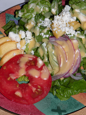 Tasty salad made with fresh peach vinaigrette, fresh peach slices and ripe local tomato